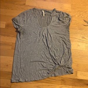 Grey tee shirt with cleavage cut out.